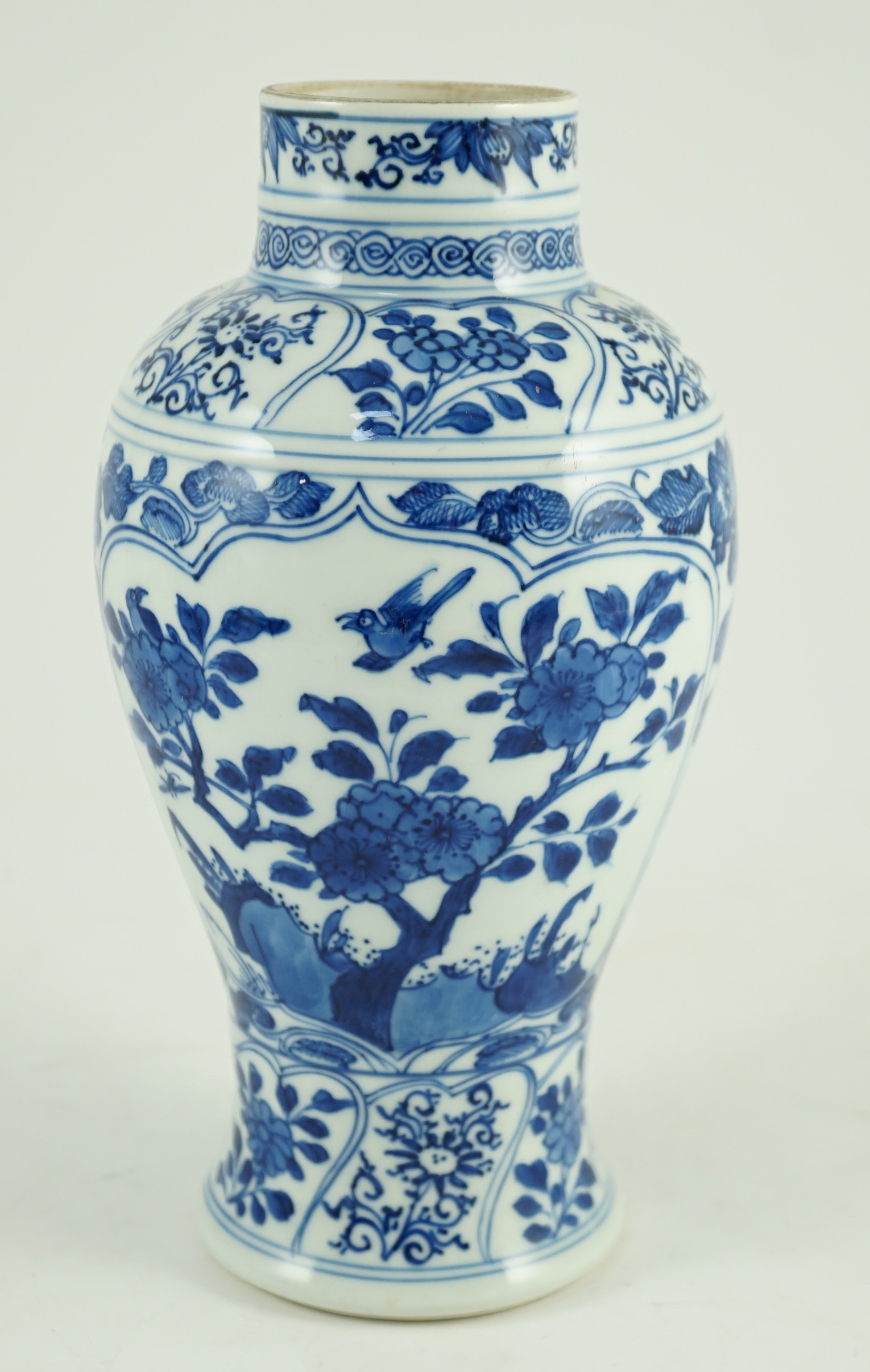 A Chinese blue and white vase, Kangxi period, 21cm high, hairline crack to neck